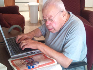 Photo of Frank G typing on his laptop keyboard